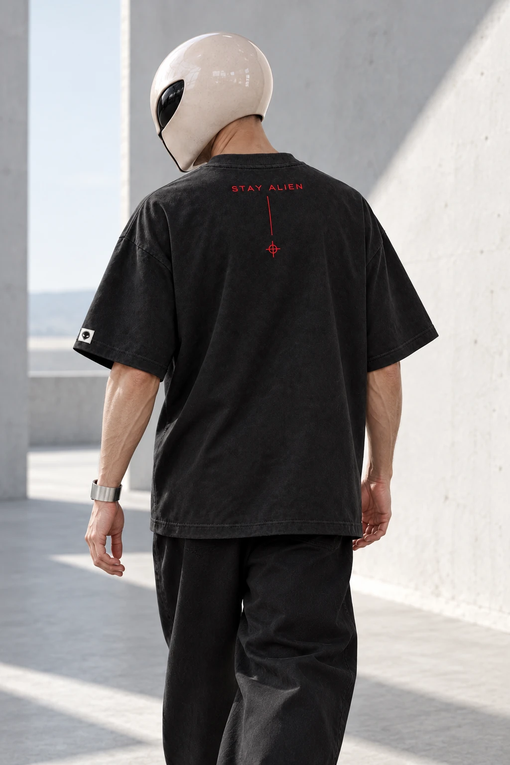 Illustrative campaign rear view of adult Wrangster wearing Entity Uniform, red Stay Alien lettering and crosshair visible.